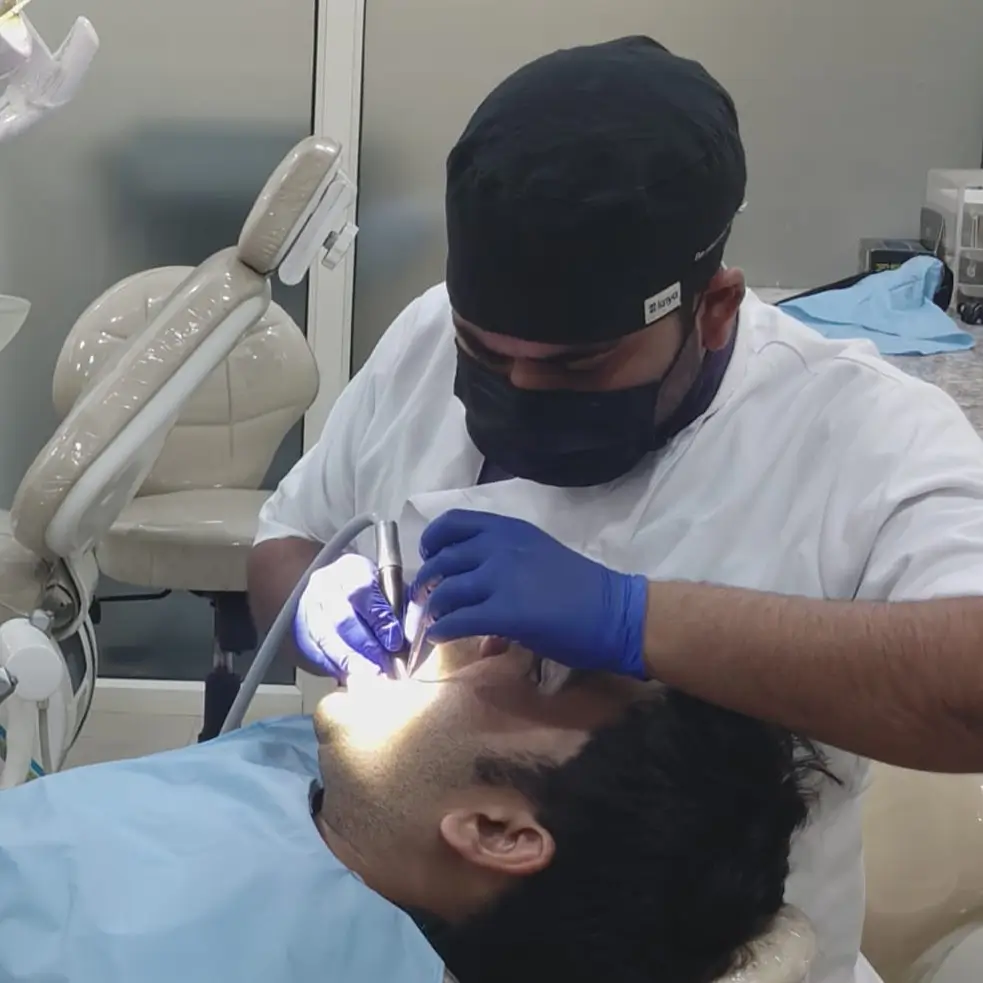Dr. M.K. Maurya treating a patient in the Face-O-Max clinic
